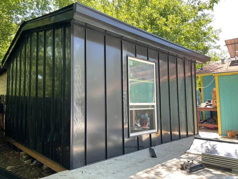 Black standing seam metal wall panels for Roof Inspection in Moss Bluff